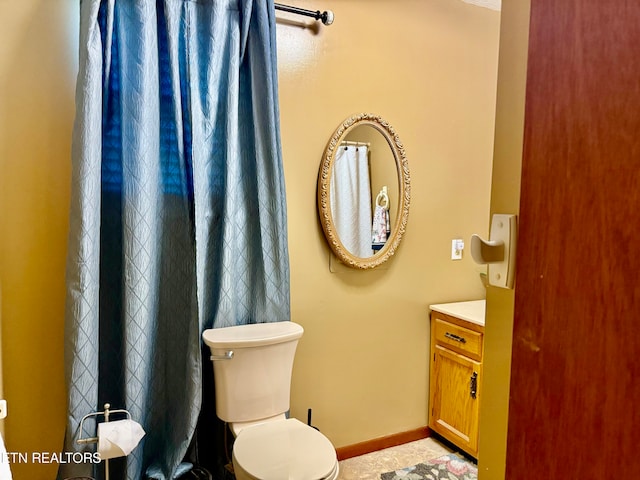 bathroom featuring vanity and toilet