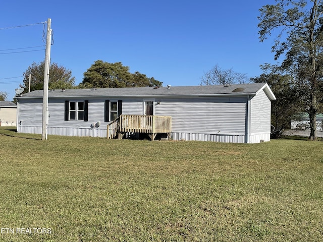 205 Magnolia Ln, Tazewell, TN 37879 - back of house featuring a yard and a deck