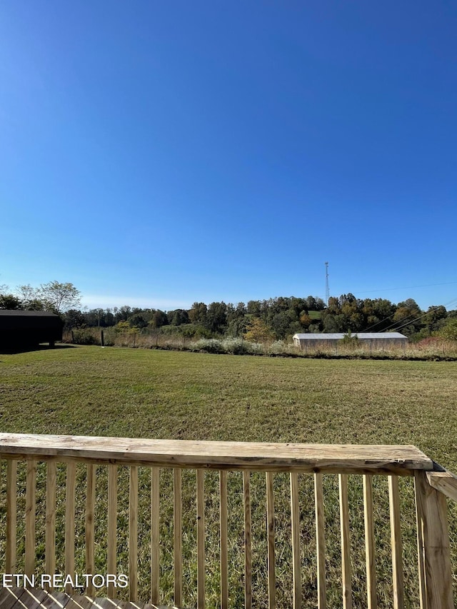 view of yard with a rural view