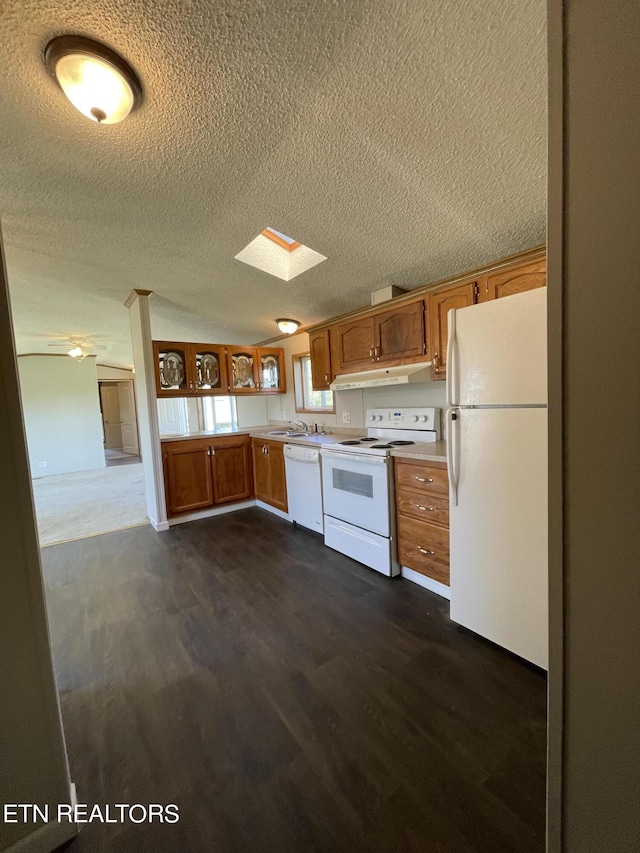 205 Magnolia Ln, Tazewell, TN 37879 - kitchen featuring white appliances, under cabinet range hood, dark wood finished floors, light countertops, and a textured ceiling