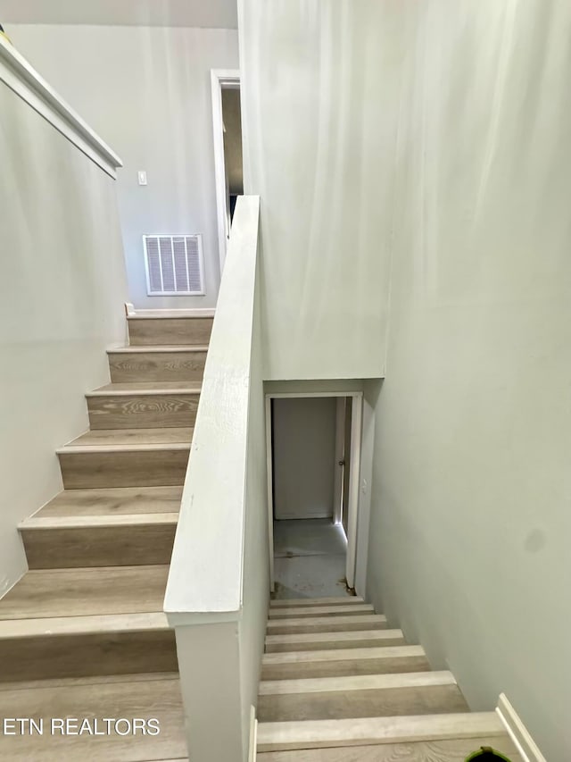 staircase with visible vents