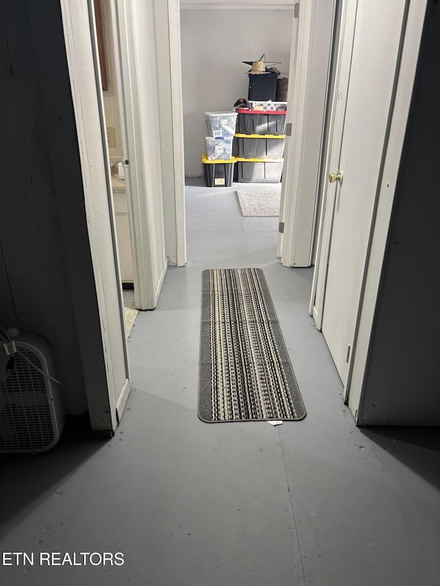 hallway featuring concrete flooring