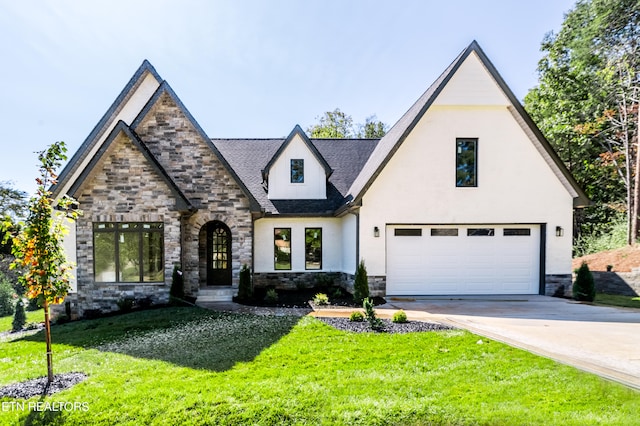 view of front facade featuring a front lawn and a garage