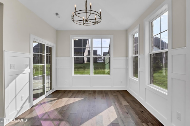 interior space with an inviting chandelier and visible vents