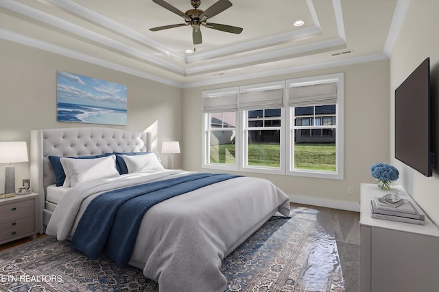 bedroom with visible vents, baseboards, a raised ceiling, ceiling fan, and recessed lighting