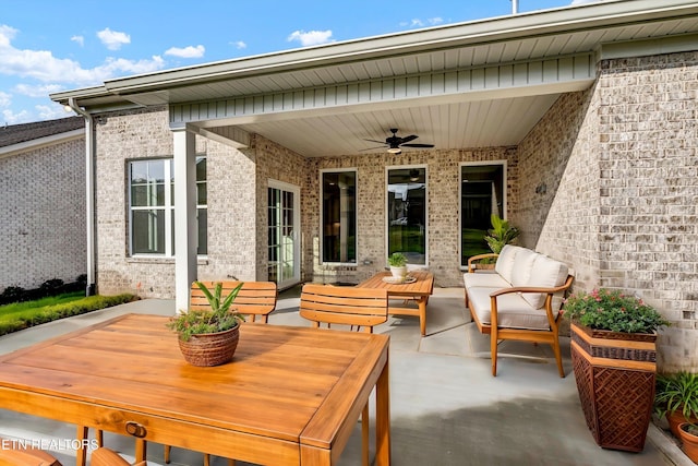 view of patio with an outdoor living space and ceiling fan