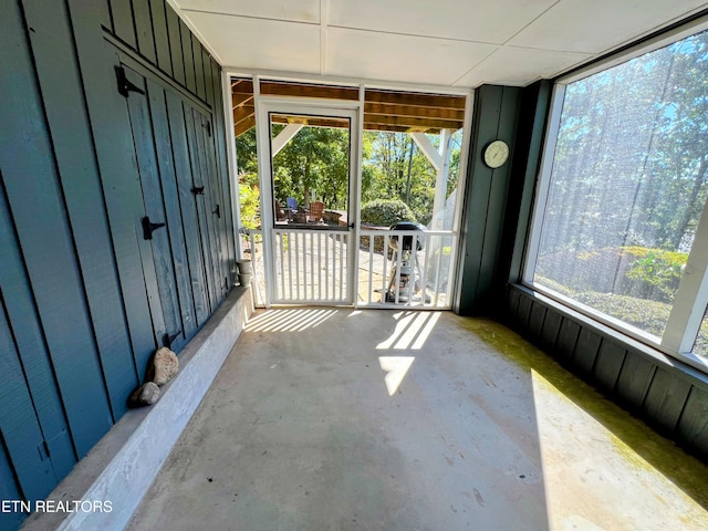 unfurnished sunroom with plenty of natural light