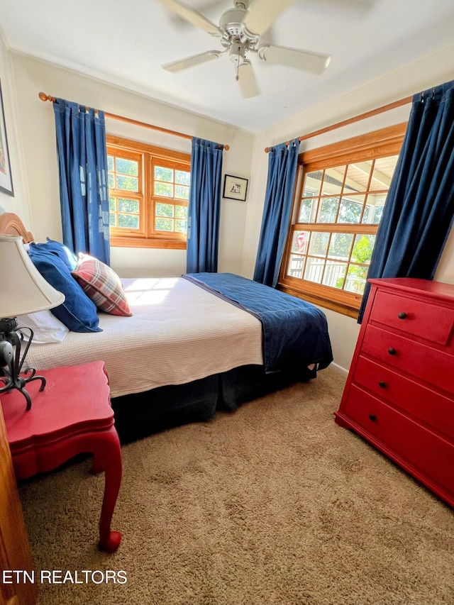 carpeted bedroom with ceiling fan