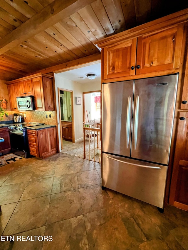 kitchen featuring wood ceiling, beam ceiling, tasteful backsplash, stainless steel appliances, and tile patterned floors