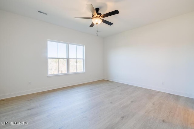 unfurnished room featuring ceiling fan and light wood-type flooring