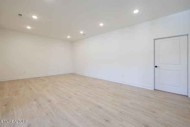 unfurnished room with light hardwood / wood-style flooring