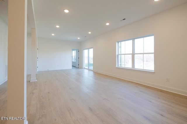 spare room featuring light hardwood / wood-style floors