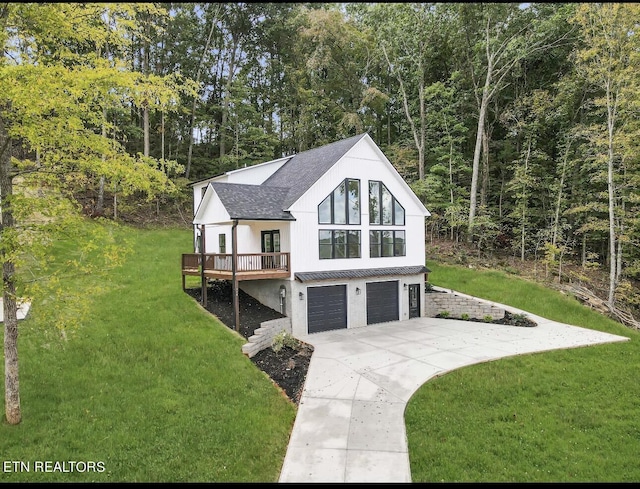 246 Clear Creek Rd, Kodak, TN 37764 - view of front of property with concrete driveway, a front lawn, an attached garage, a shingled roof, and a deck