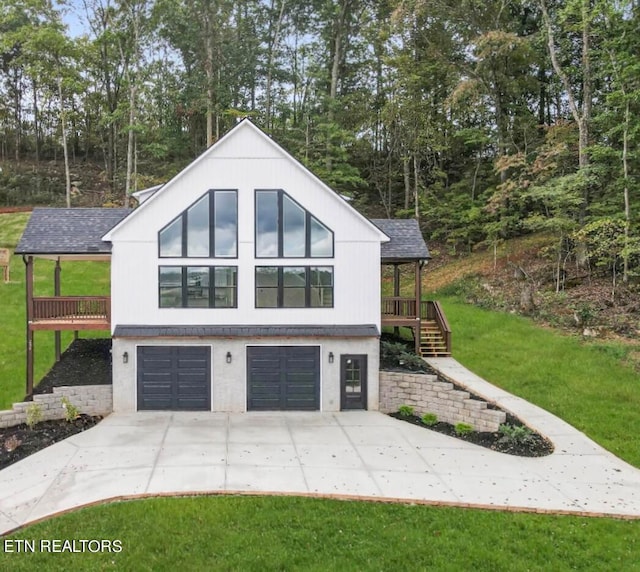 view of property exterior with a garage and a lawn