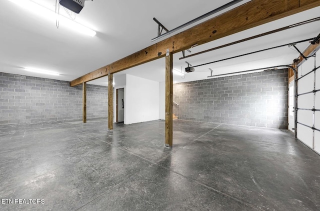 246 Clear Creek Rd, Kodak, TN 37764 - garage featuring a garage door opener and concrete block wall