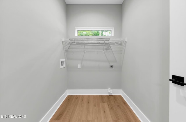 clothes washing area featuring washer hookup, hardwood / wood-style floors, and electric dryer hookup