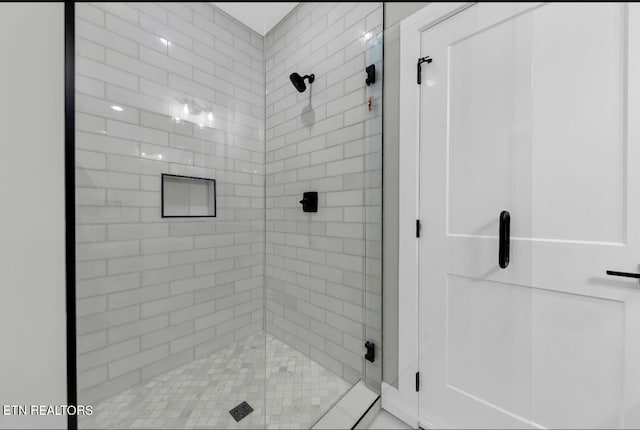 bathroom featuring an enclosed shower