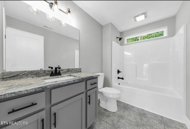 246 Clear Creek Rd, Kodak, TN 37764 - bathroom featuring toilet, vanity, and  shower combination