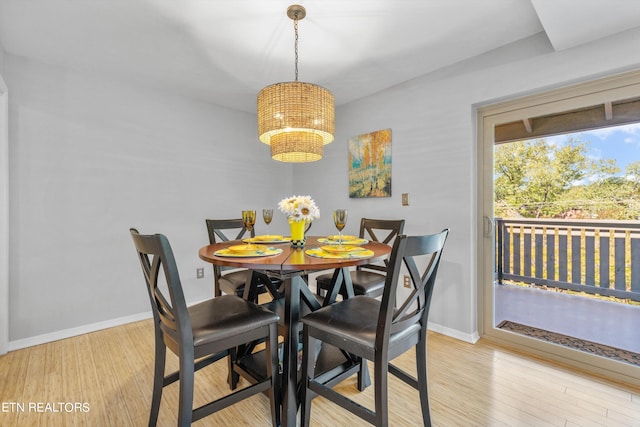 dining area featuring light wood-type flooring