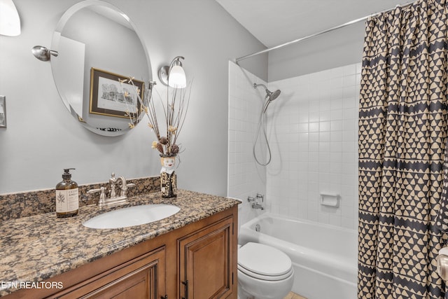 full bathroom with vanity, toilet, and shower / bath combo