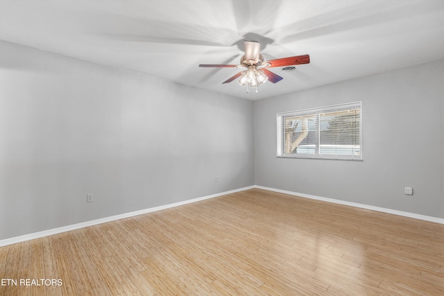 unfurnished room featuring light hardwood / wood-style flooring and ceiling fan