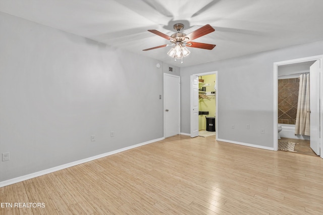 empty room featuring light hardwood / wood-style flooring and ceiling fan