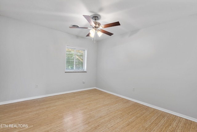 spare room featuring ceiling fan and light hardwood / wood-style flooring