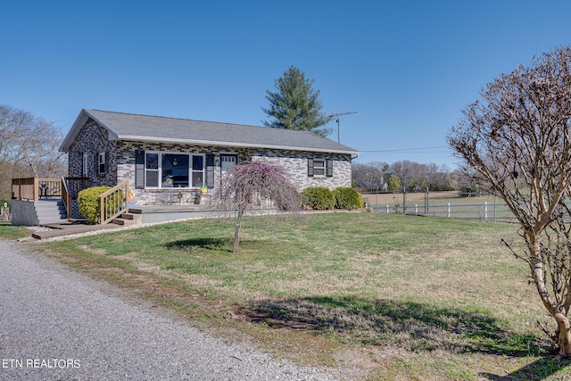 1506 W Cunningham Rd, Seymour, TN 37865 - single story home featuring stone siding, a front lawn, and fence