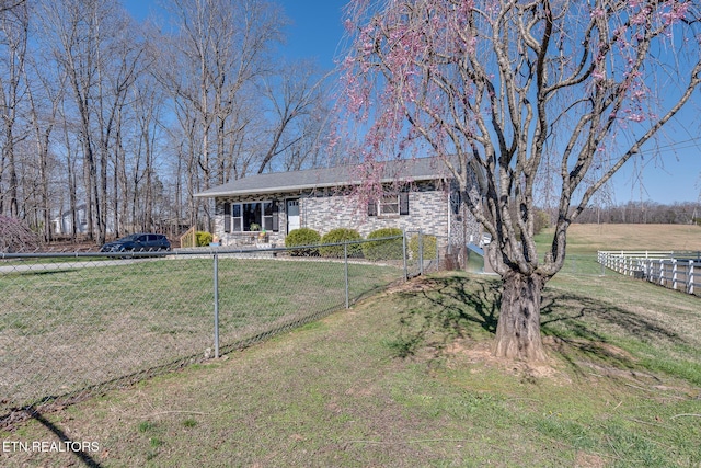 1506 W Cunningham Rd, Seymour, TN 37865 - ranch-style house featuring fence, a front lawn, and stone siding