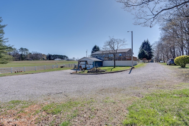 1506 W Cunningham Rd, Seymour, TN 37865 - exterior space with a rural view, street lighting, and gravel driveway
