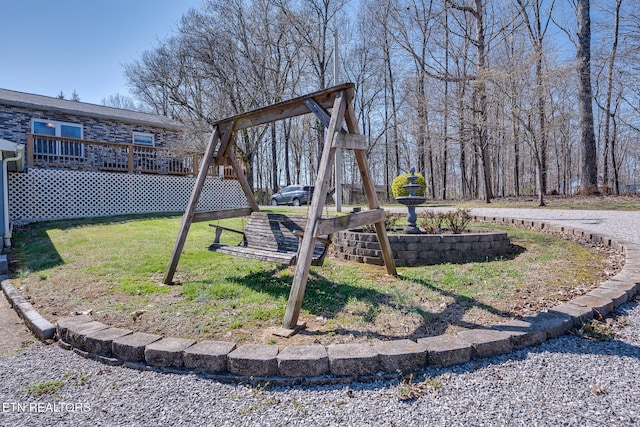 view of yard with a wooden deck