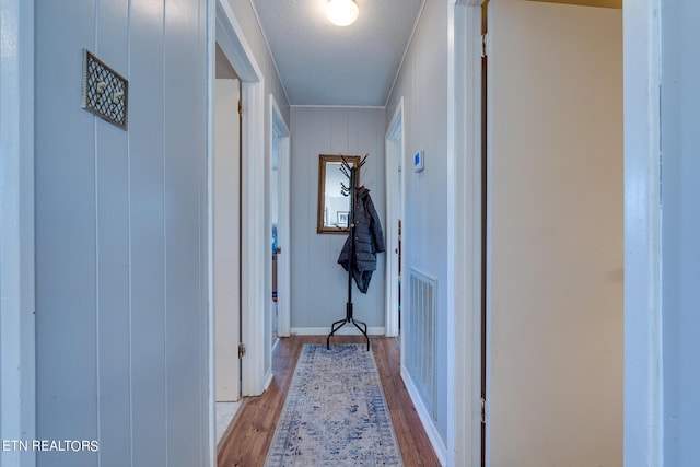 1506 W Cunningham Rd, Seymour, TN 37865 - corridor with baseboards, light wood-type flooring, and a textured ceiling