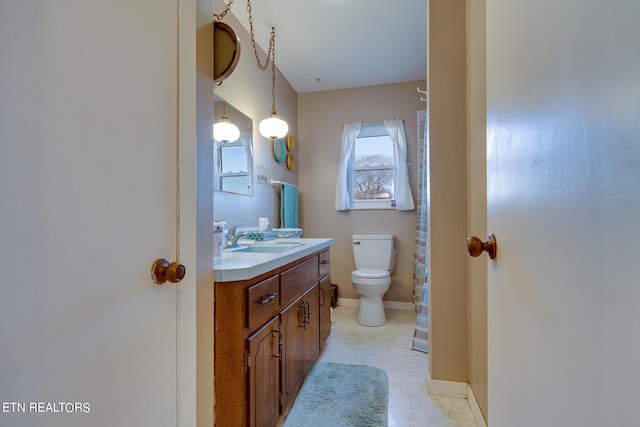 1506 W Cunningham Rd, Seymour, TN 37865 - bathroom featuring toilet, baseboards, and vanity