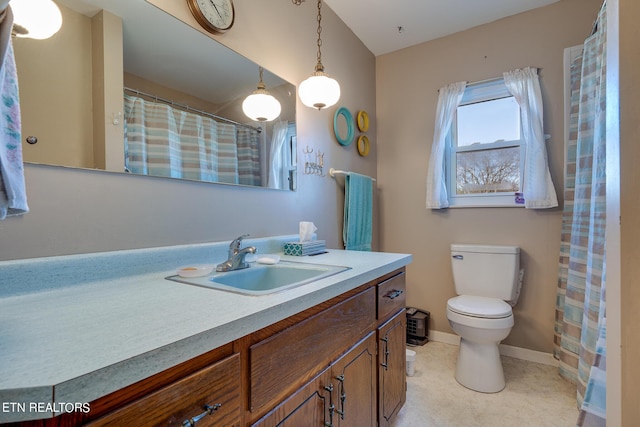 1506 W Cunningham Rd, Seymour, TN 37865 - bathroom with vanity, toilet, and baseboards