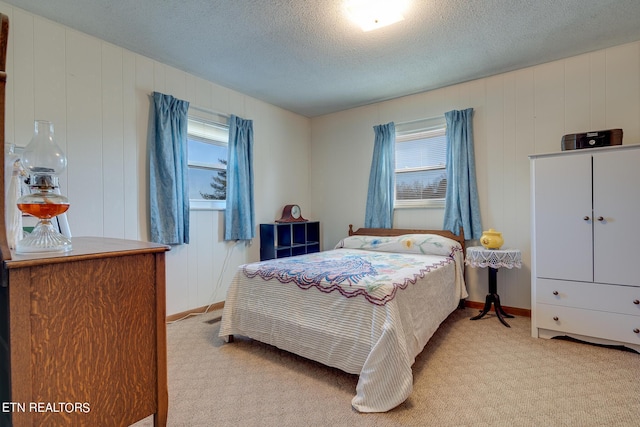 1506 W Cunningham Rd, Seymour, TN 37865 - bedroom with light carpet, a textured ceiling, and baseboards