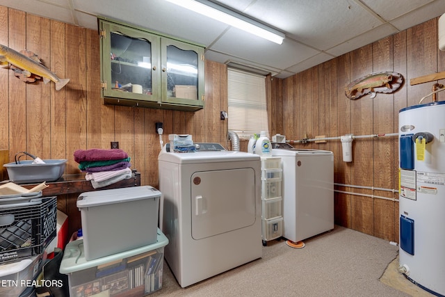 1506 W Cunningham Rd, Seymour, TN 37865 - washroom featuring cabinet space, water heater, light colored carpet, wooden walls, and washing machine and dryer