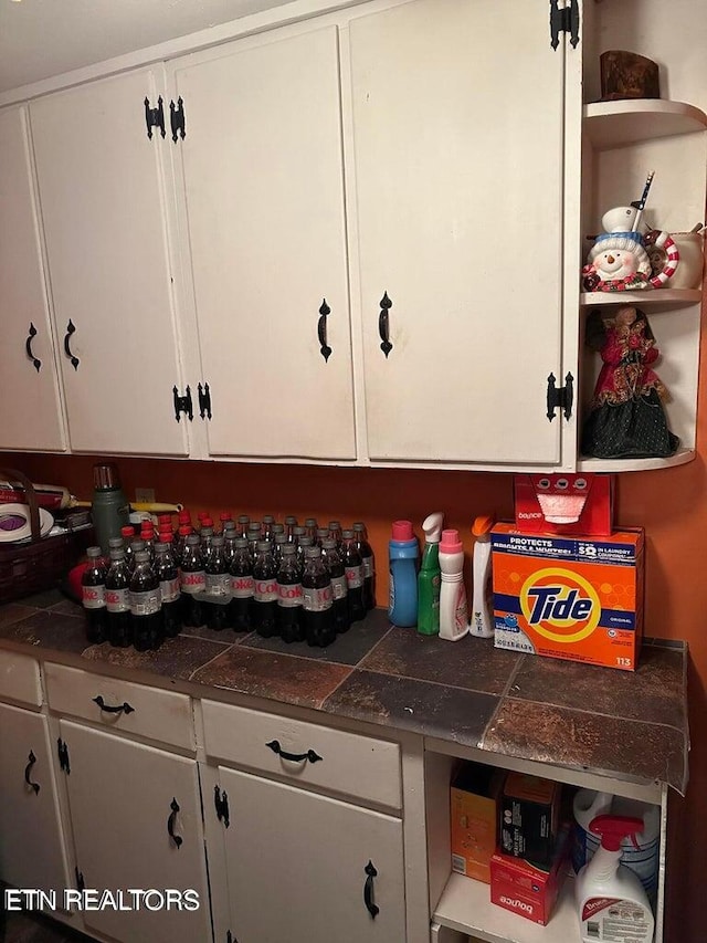 kitchen featuring white cabinets