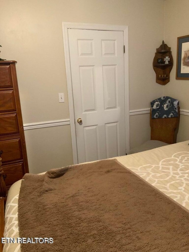 carpeted bedroom featuring a closet