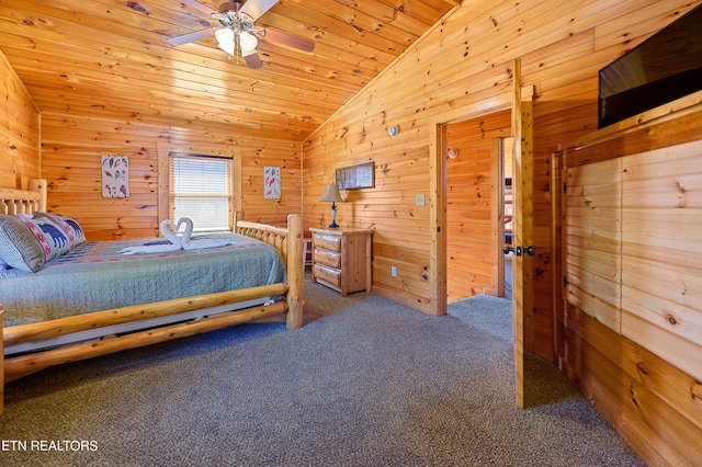 bedroom with ceiling fan, wooden walls, wooden ceiling, carpet floors, and vaulted ceiling