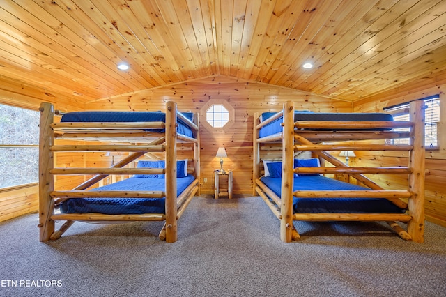 unfurnished bedroom with wood walls, wood ceiling, vaulted ceiling, and multiple windows