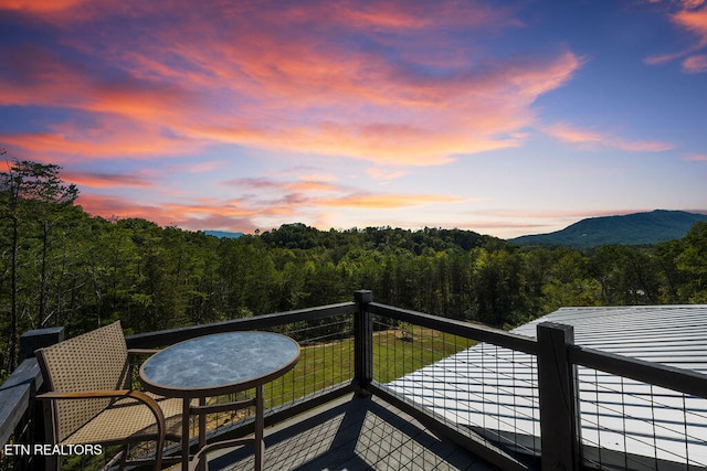 balcony at dusk with a mountain view