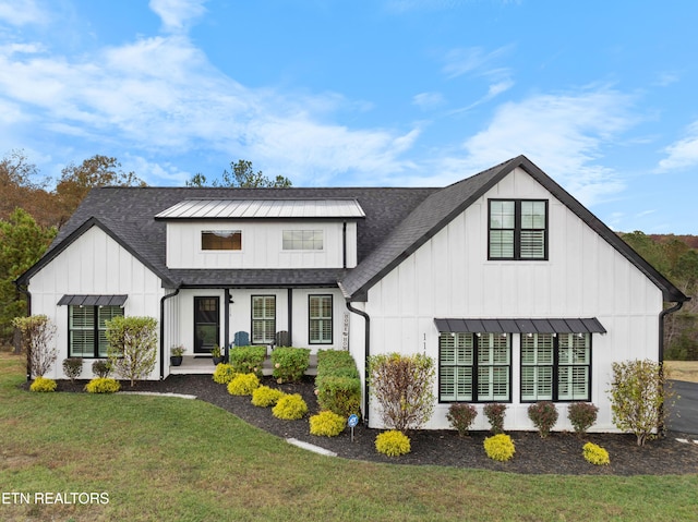 modern farmhouse with a front lawn