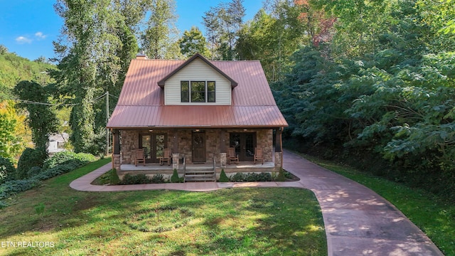 view of front of house with a porch and a front yard