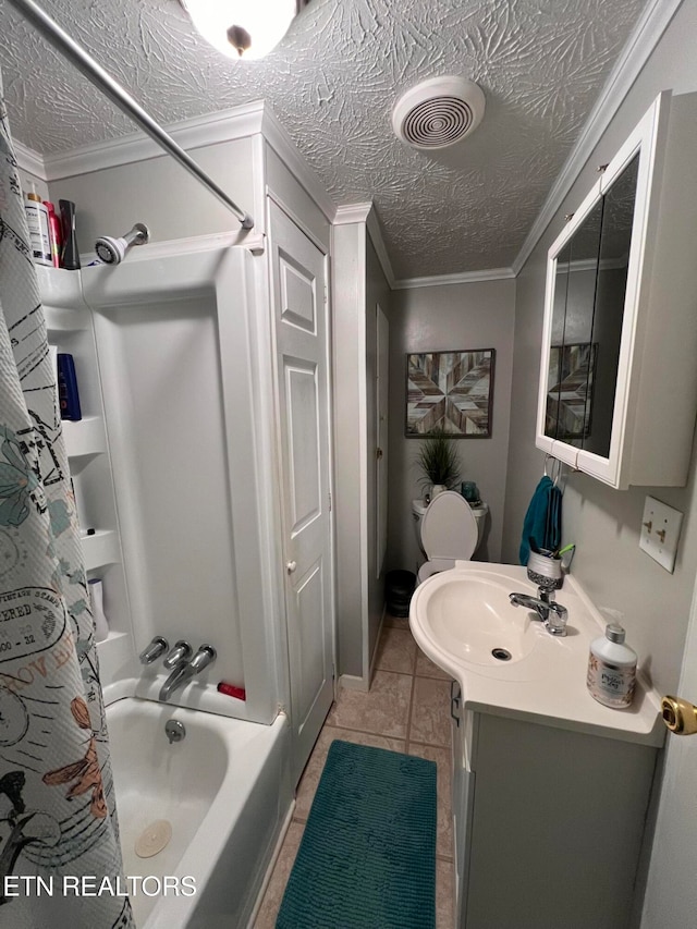 bathroom featuring tile patterned flooring, vanity, ornamental molding, and a textured ceiling