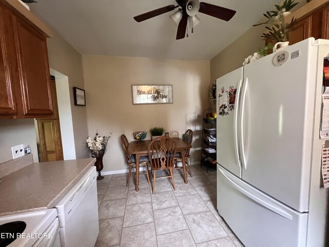 59 River Rd, Miracle, KY 40856 - kitchen with white appliances, ceiling fan, and brown cabinets