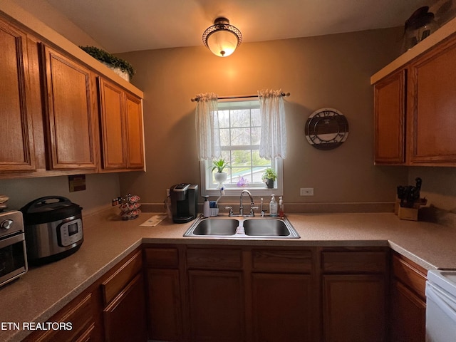 kitchen with white stove and sink