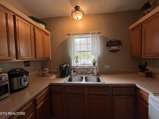 59 River Rd, Miracle, KY 40856 - kitchen featuring brown cabinets, light countertops, and stove