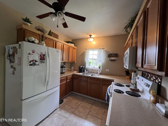 59 River Rd, Miracle, KY 40856 - kitchen with white appliances, a ceiling fan, light countertops, and brown cabinets