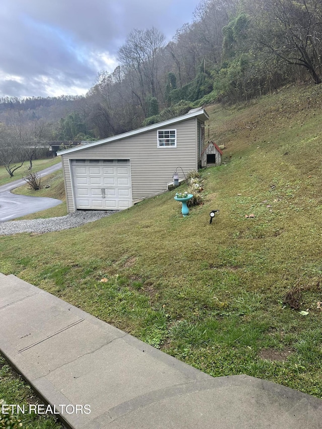 59 River Rd, Miracle, KY 40856 - view of side of property with a yard, an outbuilding, and driveway