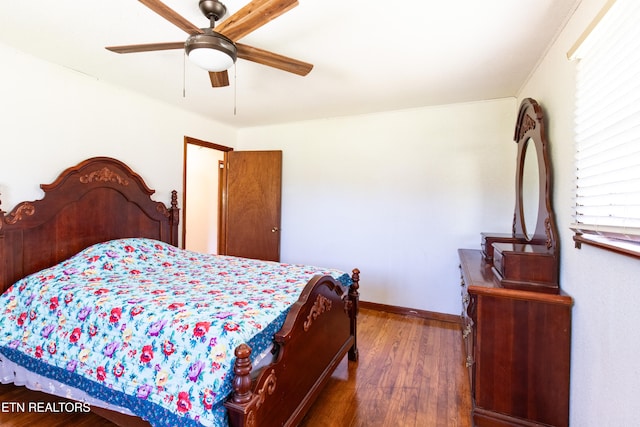 bedroom with ceiling fan and dark hardwood / wood-style flooring